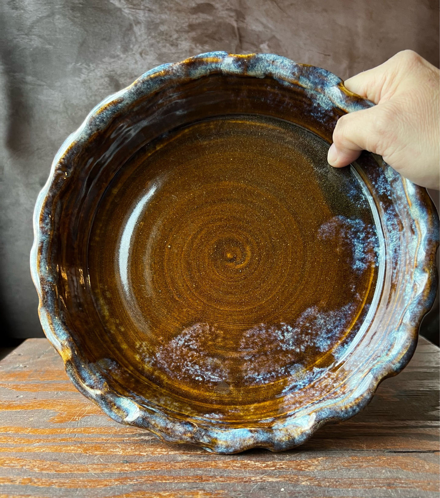 Hand made cottagecore pie dish in shades of browns and blue glaze.
