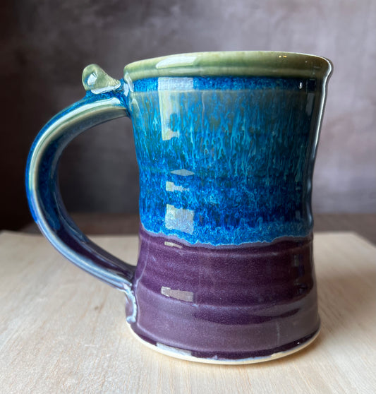slow sipper mug glazed in purple green and blue