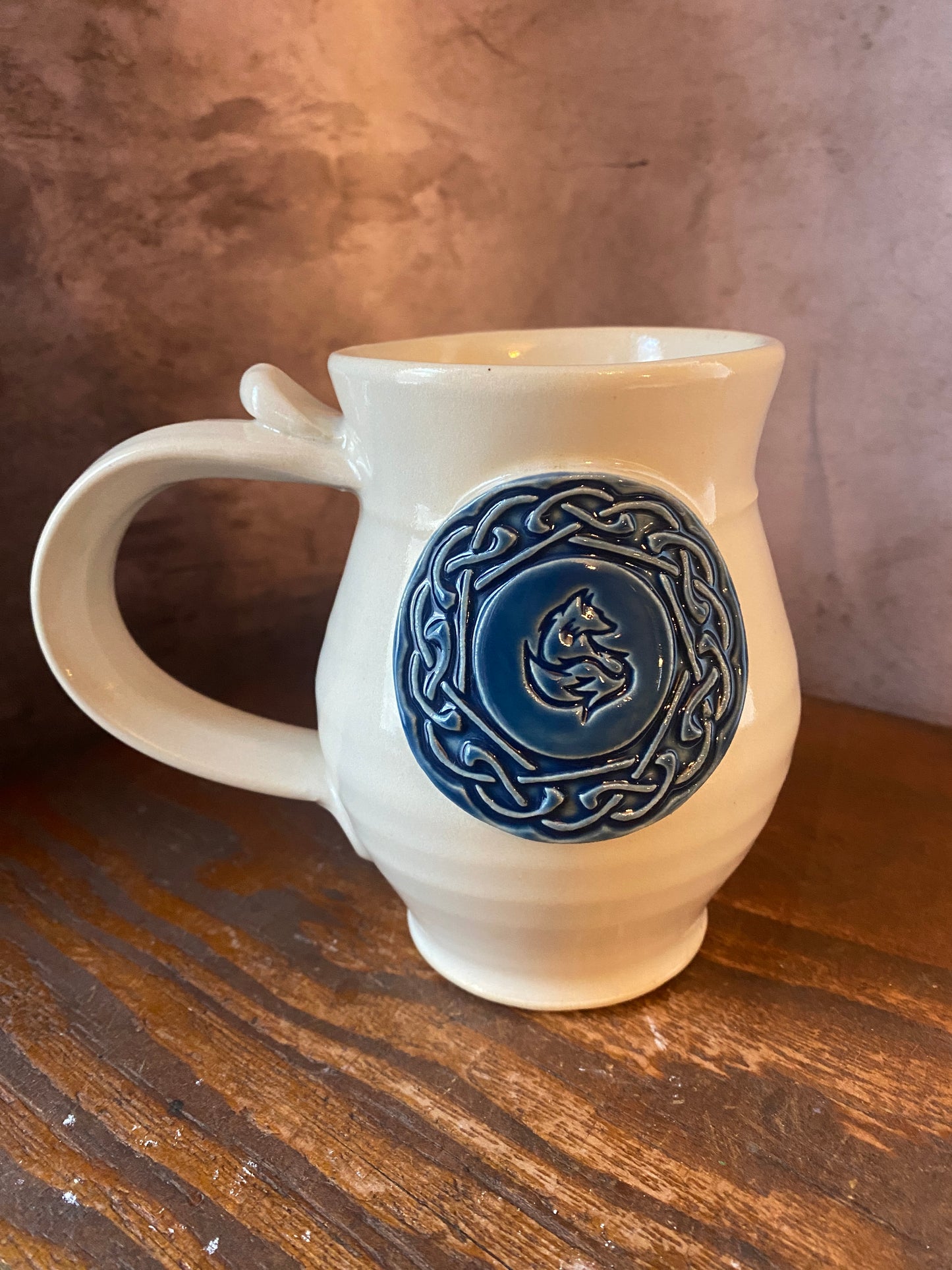 White mug with blue fox and Celtic Knot medallion