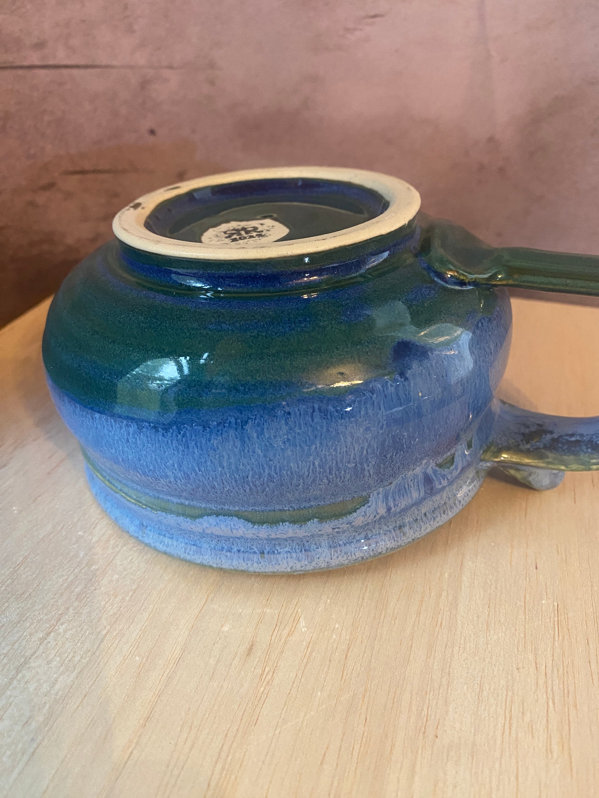 bottom view of our blue soup mug with handle.