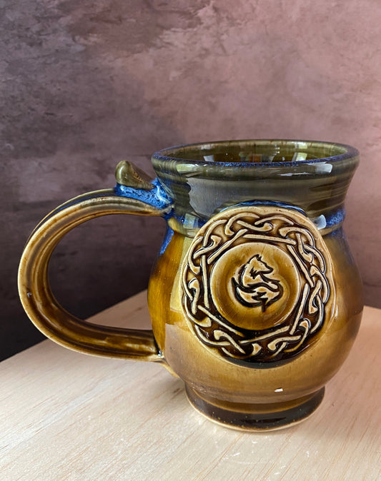 Hand thrown ceramic mug with Celtic knot surround a fox