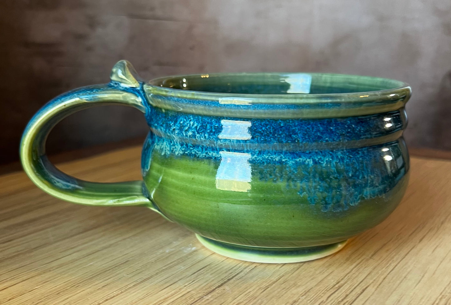 Hand thrown soup mug with handle. Blue and green glazed ceramic. 