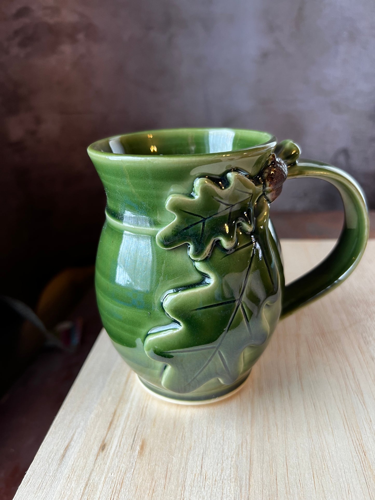 Mug for left handed people oak and acorn design.