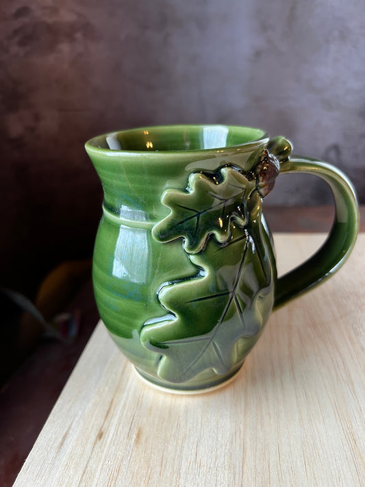 Mug for left handed people oak and acorn design.