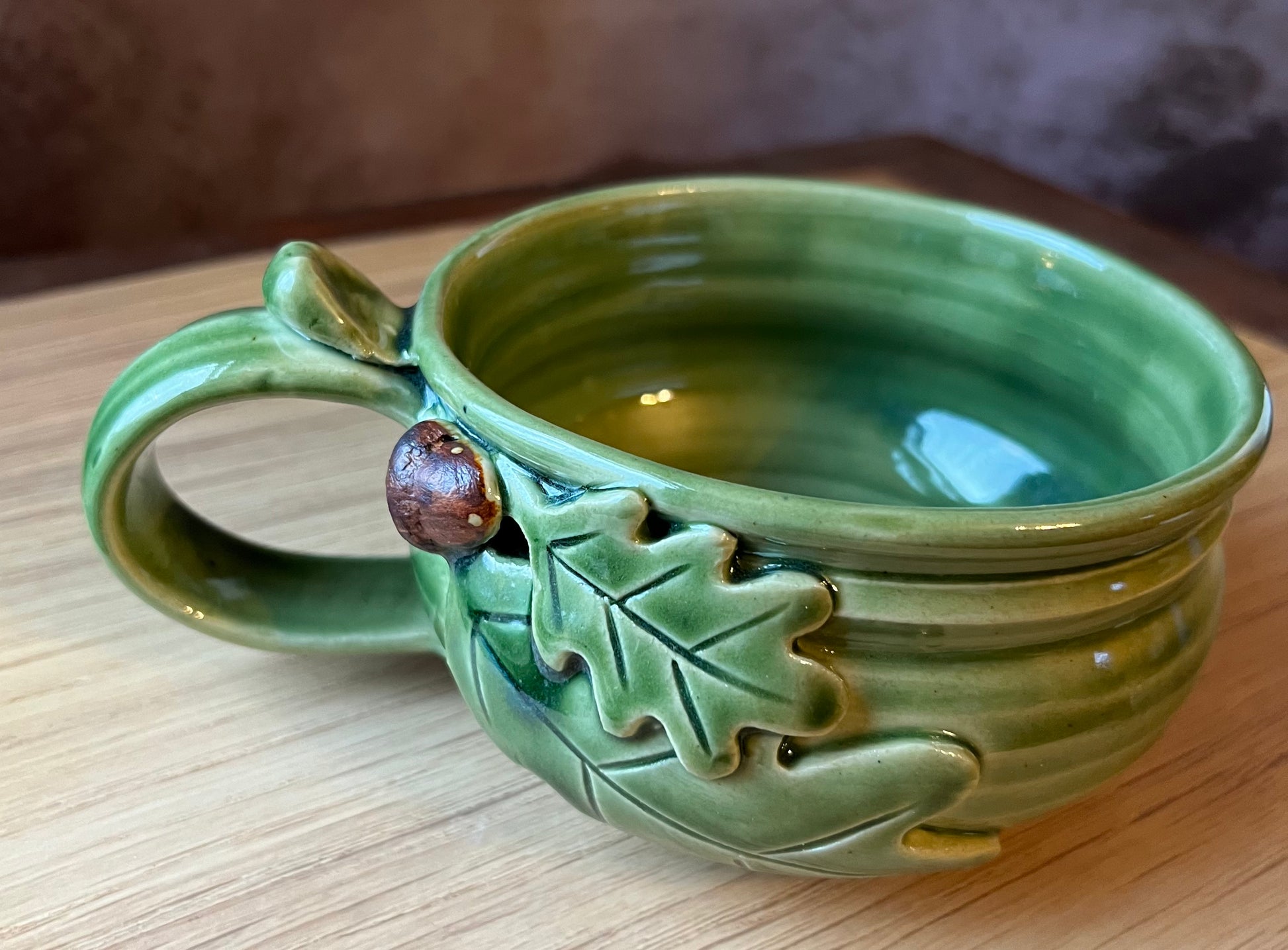 Custom soup bowl with oak leaves and acorn in green glazed pottery